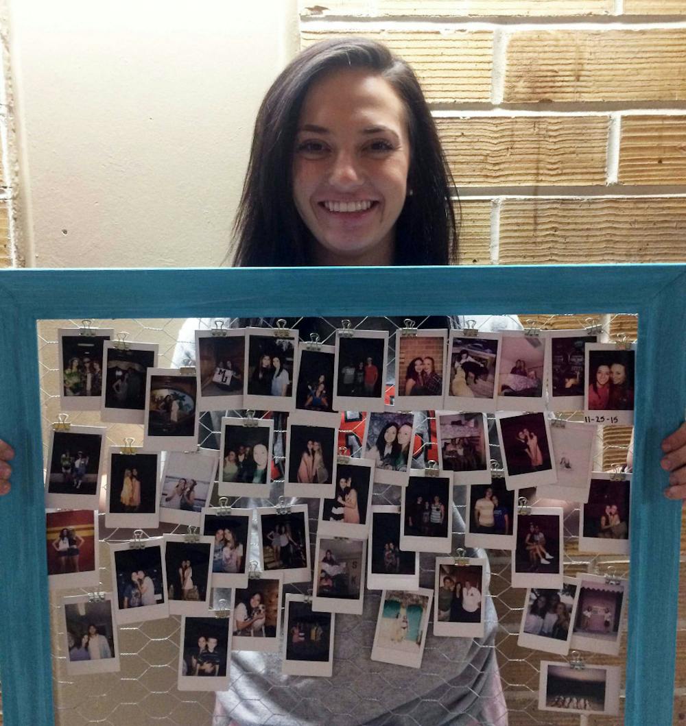 Savannah Byrd shows off her polaroid collection.