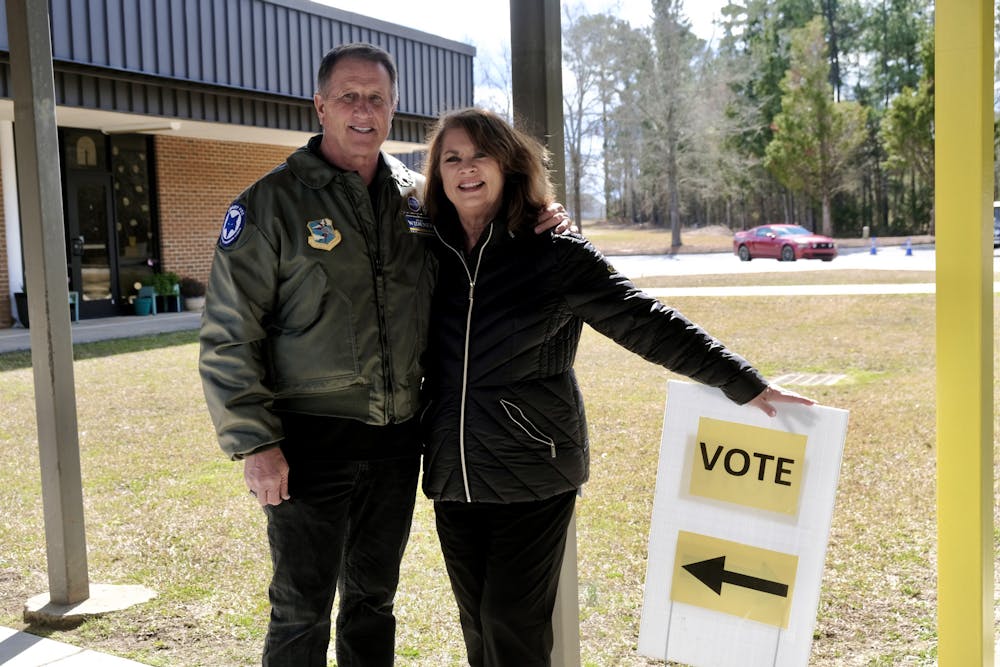 <p>Dean and Lisa Widener, Columbia, SC voters and politicians, pose with a &quot;VOTE&quot; sign outside a voting precinct in Richland county, South Carolina. Dean is an Air Force Veteran and an SC House candidate for the South Carolina District 85 House race happening Summer 2024.</p>