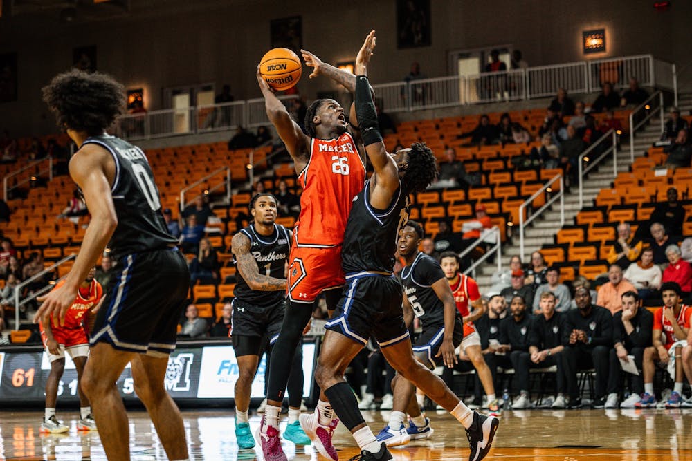 Center Armani Mighty '27 shoots a contested two in the paint against Georgia State University on Tuesday, Dec. 2.