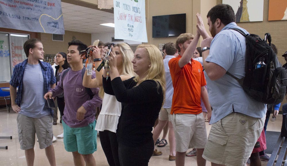 Students gather to see who's on the SGA General Election winner's banner. Pictured from left to right: Jordan Price, Pornchai Chantha, Alexandra Kirschbaum, Millie Smith, Matthew Long.
