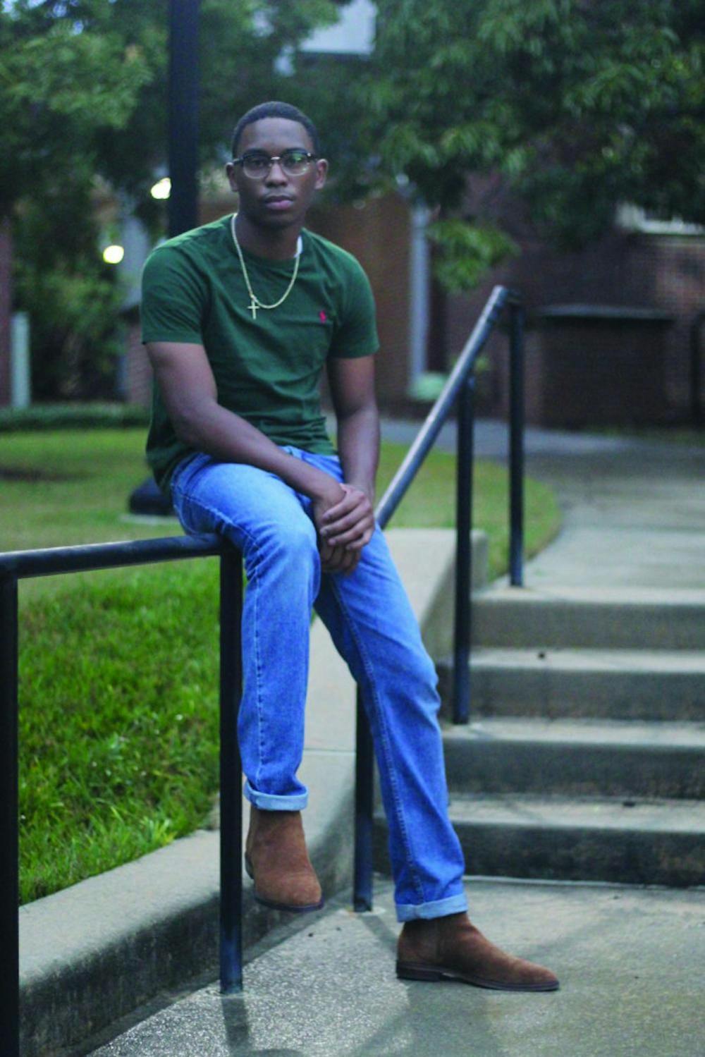 Joshua Lymon poses for a photo on campus.
