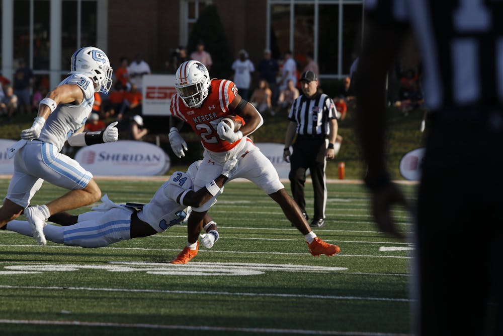 Running back Tyrell Coard '27 shakes off a defender against The Citadel on Sept. 21. Coard operates as the third back in the pecking order, but added 34 yards of his own in Mercer's win over Princeton on Oct. 12.