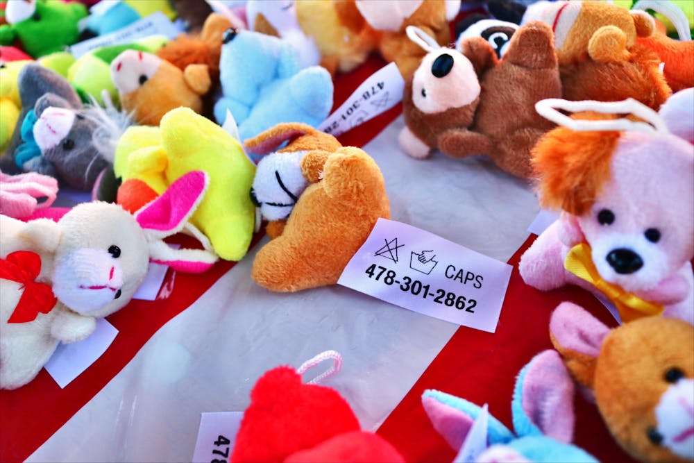Plush animals covered the Counseling and Psychological Services table, each tagged with a resource number.