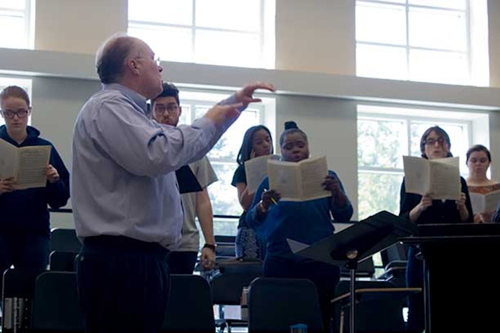 A chorus of Mercer Bears, directed by the Townsend school of music's Professor Stanley Roberts, practices for the upcoming Kaleidoscope Concert. The Nov. 5 concert, which will be part of the 2016 Homecoming events, will feature performances from a variety of different instrument groups.