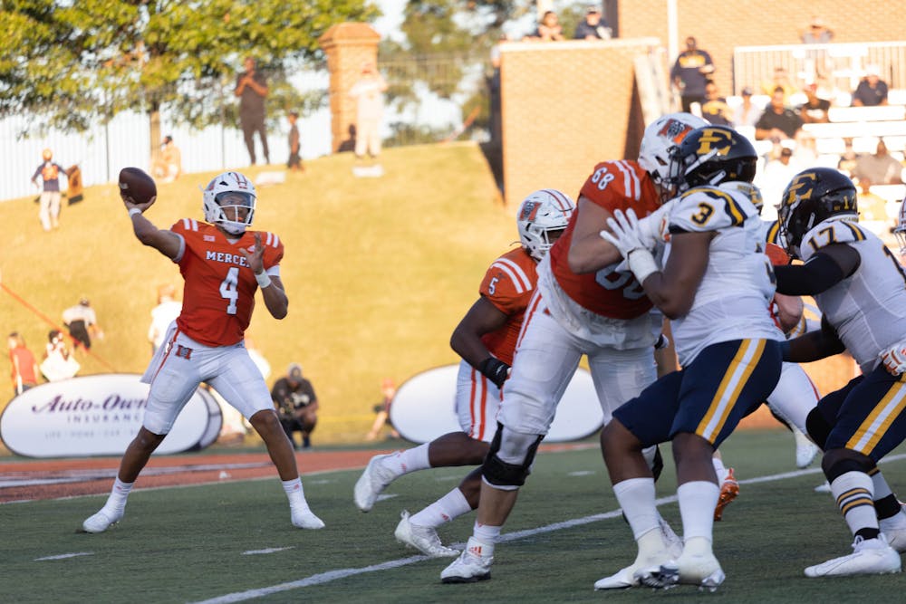 <p>Fred Payton (#4) throws a pass in the game against ETSU on Saturday. He set a record for touchdown passes thrown in one game, completing five total. Payton threw for 383 yards and completed 23 of his 35 attempted passes. </p>