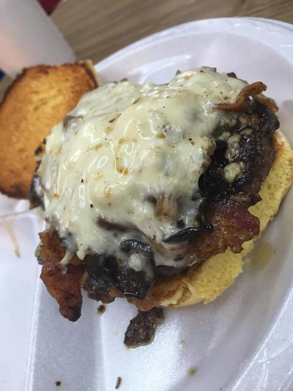 The Dickey Betts' burger is blackened and topped with bacon, blue cheese, Swiss cheese, mushrooms and onions. Biscuit Burgers and more wow taste buds with so many flavors packed into their burgers. 