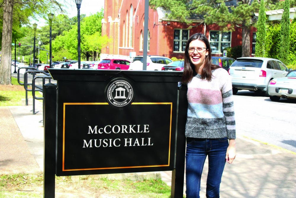 Amelia Rivers stands outside the McCorkle Music Hall.