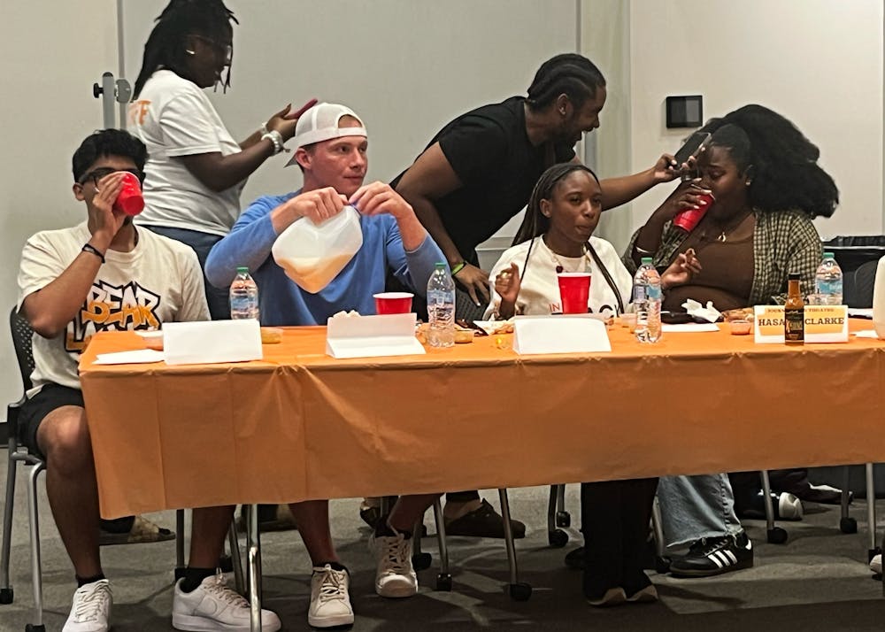 The panel of student contestants faced the biggest challenge of the night, eating the hottest wing sauce as punishment for losing the Hot Wings and Hot Questions game Quadworks hosted on Sept. 19.