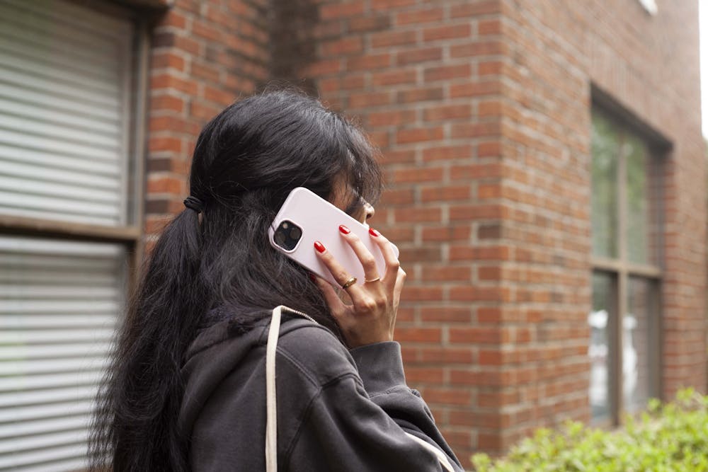 <p>A Mercer student, Khai Clay, talks on her cell phone.</p>