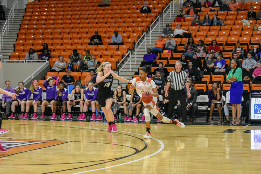 Sophomore guard Shannon Titus drives to the basket against the Furman defense.
