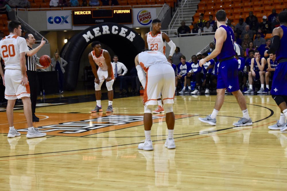 Mercer guard Jordan Strawberry catches his breath during a break in the action. 