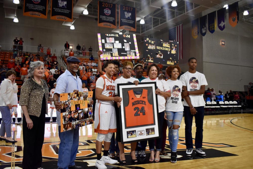 Kahlia Lawrence posing for a photo with her family.
