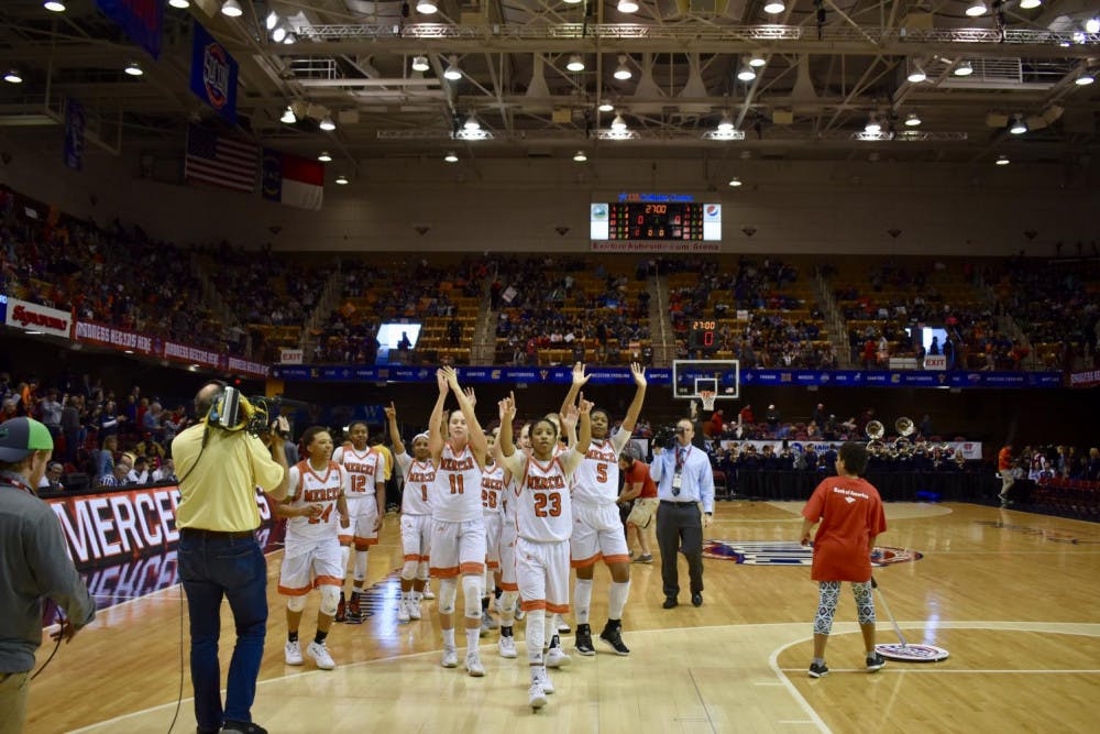 The Women's basketball team walking off the court after their victory over Samford.