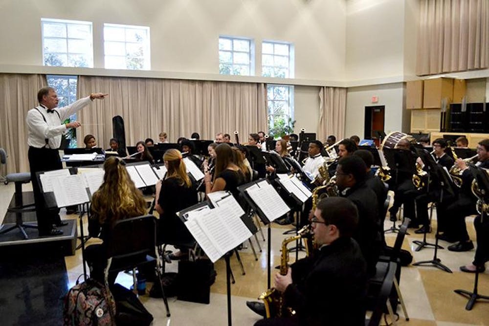 Mercer University's Wind Ensemble prepares for their upcoming concert.