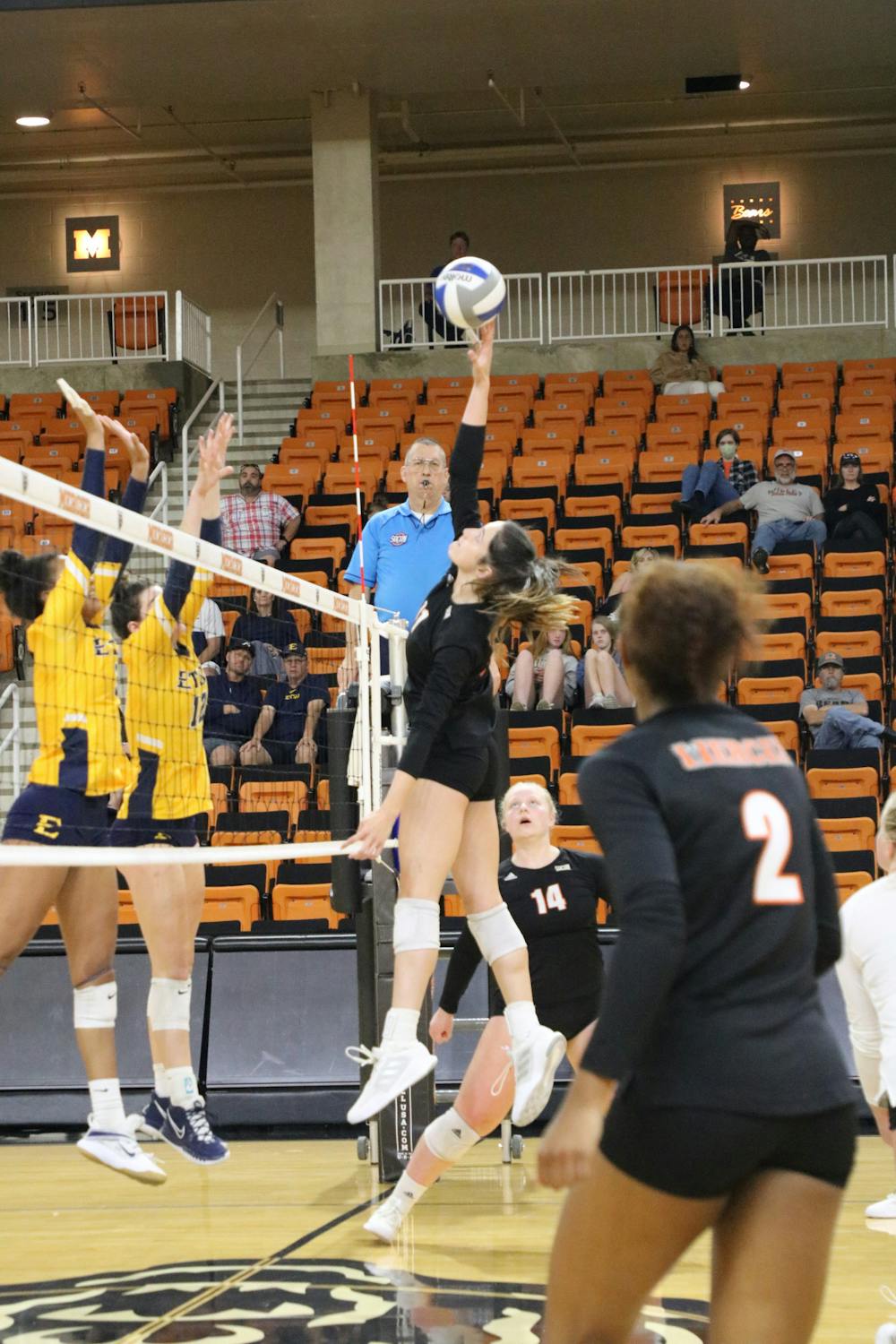 <p>Paige Wagers (#11) reaches for the ball in the game against Eastern Tennessee State University on Saturday, October 1. Wagers had eight kills in the match, but the Bears ultimately lost 3-1 to the Pirates. Photo provided by Mercer Athletics.</p>