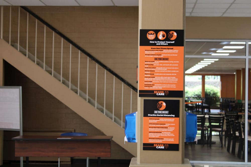 Signage in the Connell Student Center informs patrons about university safety measures during the COVID-19 pandemic.