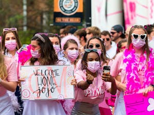 Members of Phi Mu cheer on new members before they “run the hill” during Panhellenic Bid Day on Sept. 6, 2021. This year’s bid day theme for Phi Mu was "Dreamhouse."
