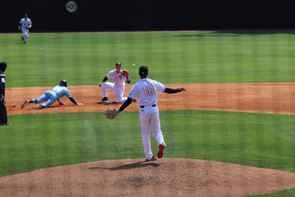 Bears pitcher Ryan Lobus (#18) attempts to pick off a Citadel runner. The attempt would fail, but Mercer won the game 4-1. 