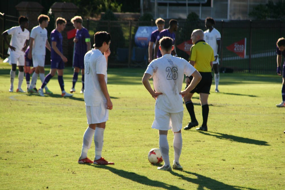 <p>Midfielder Dylan Gaither (#10) standing next to forward Michael Ille (#26) during their game against Furman on Nov 7. </p>