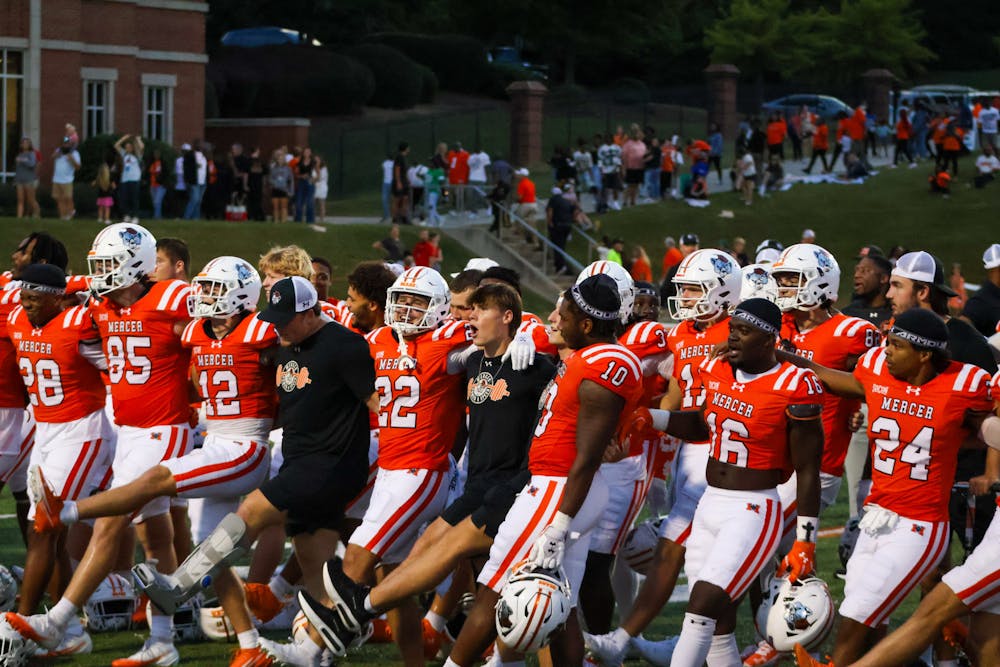 The football team celebrates their victory over Samford University, 45-21, on Saturday, Oct. 4.