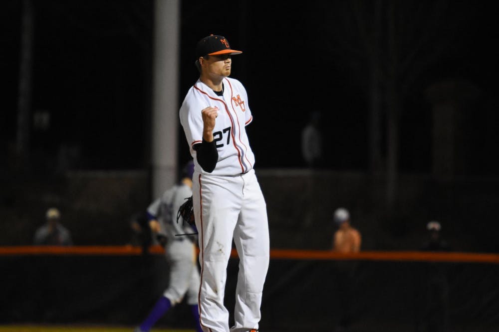 Senior pitcher Kevin Coulter (27) celebrates after recording the save in Mercer's victory over Evansville on Friday night.