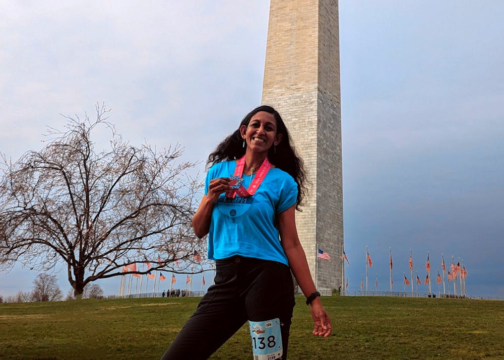 Mercer’s Associate Physics Professor Chamaree de Silva posed for a portrait after a race in D.C. Photo courtesy of de Silva.