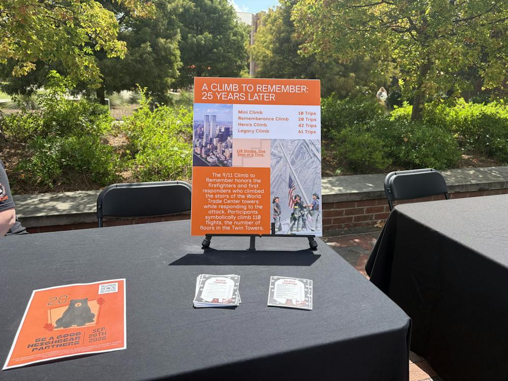 A table advertising the Climb to Remember sits near the steps of the University Center. The event was hosted by Mercer's Service and Civic Engagement office.
