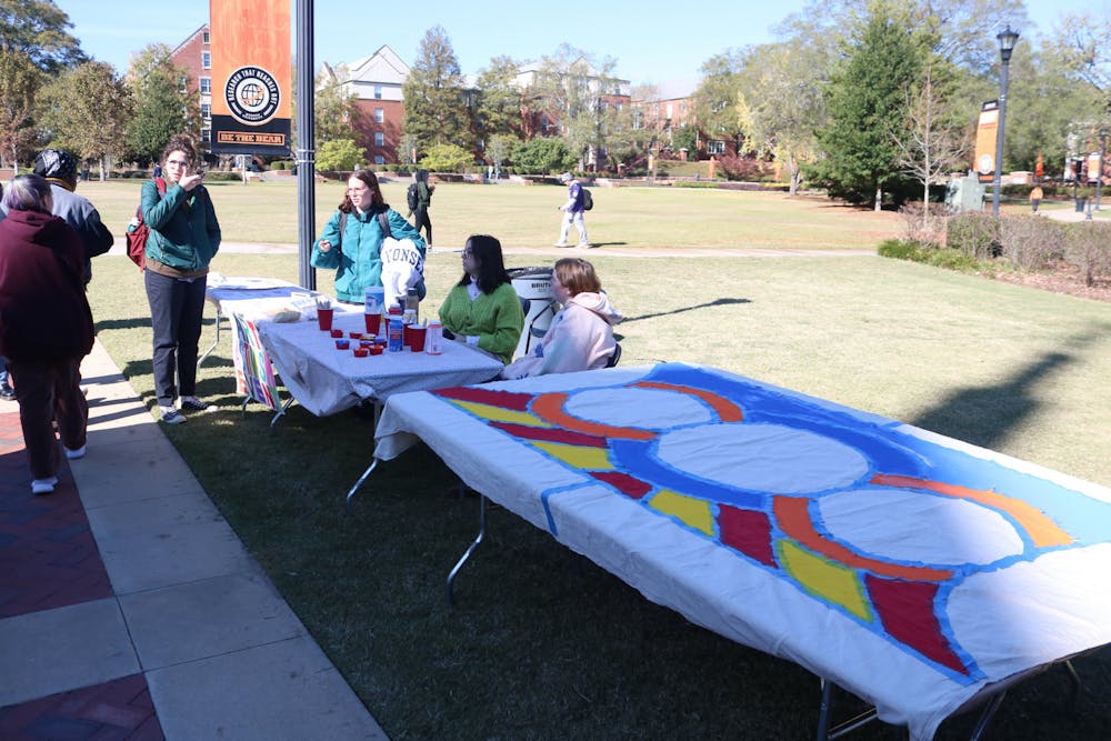 Mercer students participate in an Art and Activism mural painting event on Cruz Plaza on Nov. 18.