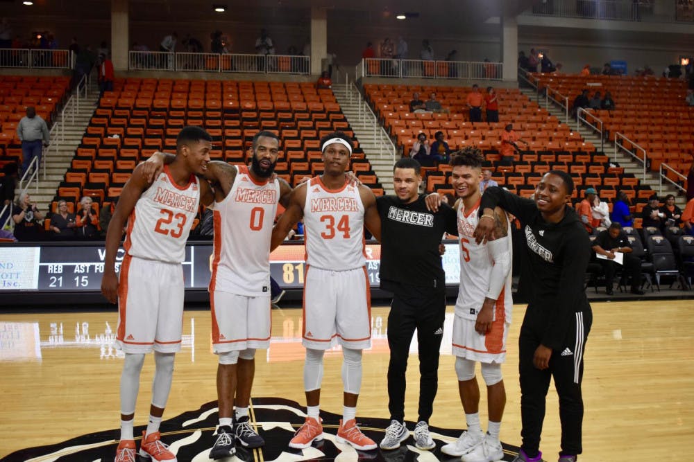 The six Mercer Bears seniors after their victory over Western Carolina (left to right) Demetre Rivers, Desmond Ringer, Stephon Jelks, Ria'n Holland, Jordan Strawberry and Rashad Lewis. Photo by Christian Hartley.