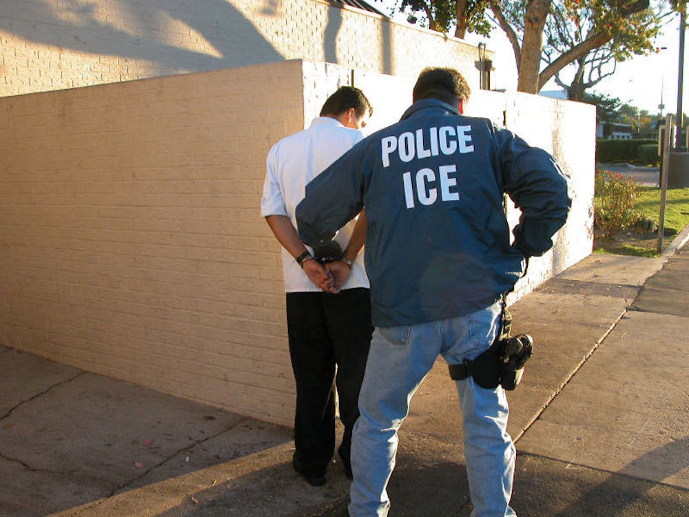 ICE police officer making an arrest. Photo provided by Wikipedia Commons.