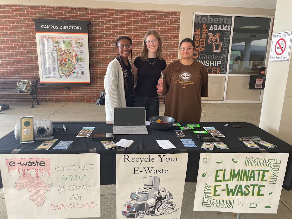 From left: Alyssa Ansley ‘27, Kaylin Stone ‘27 and Kiera Perry ‘28 at their E-Waste Awareness Table on Nov. 19, 2025.