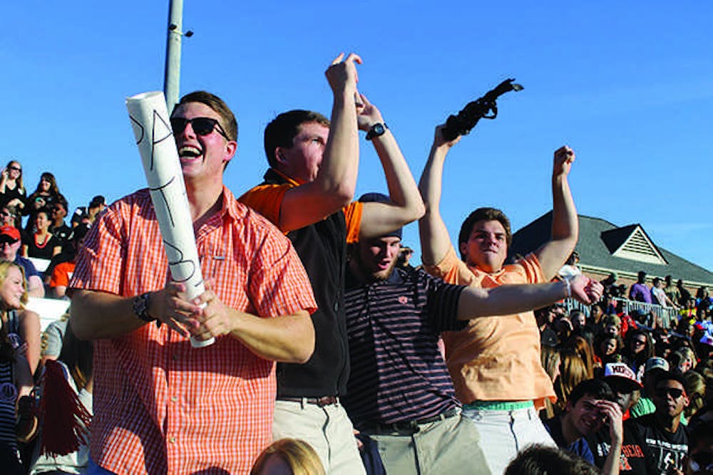 Students celebrate as Mercer scores a touchdown.