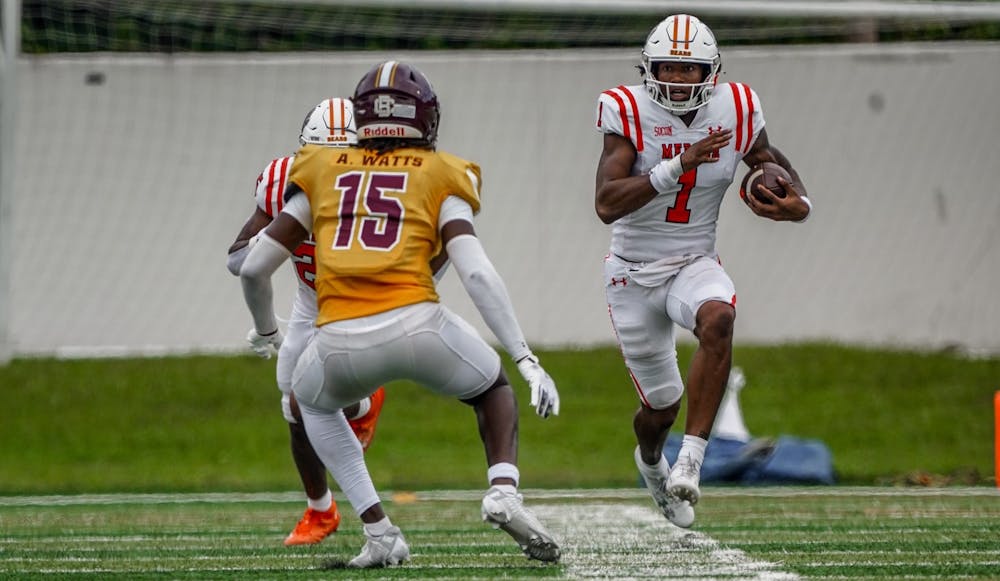 Bears quarterback DJ Smith '26 carries the ball against Bethune-Cookman University. He finished the game with 24 yards on the ground and 237 through the air.