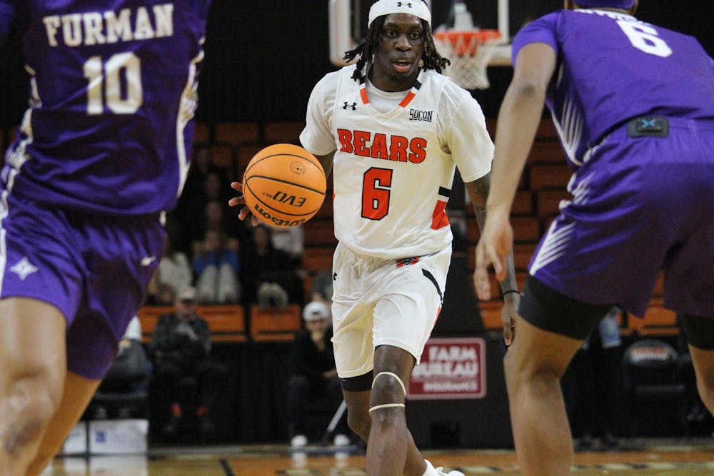 Baraka Okojie '27 takes on a defender in a game against Furman University on Feb. 11.