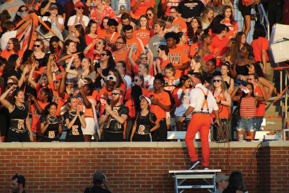 The student section cheers during the first home game of the season.