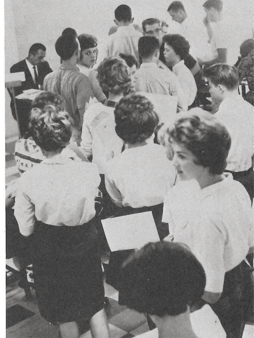  Photos from the Cauldron, Mercer's yearbook, show students waiting in line to register for classes.