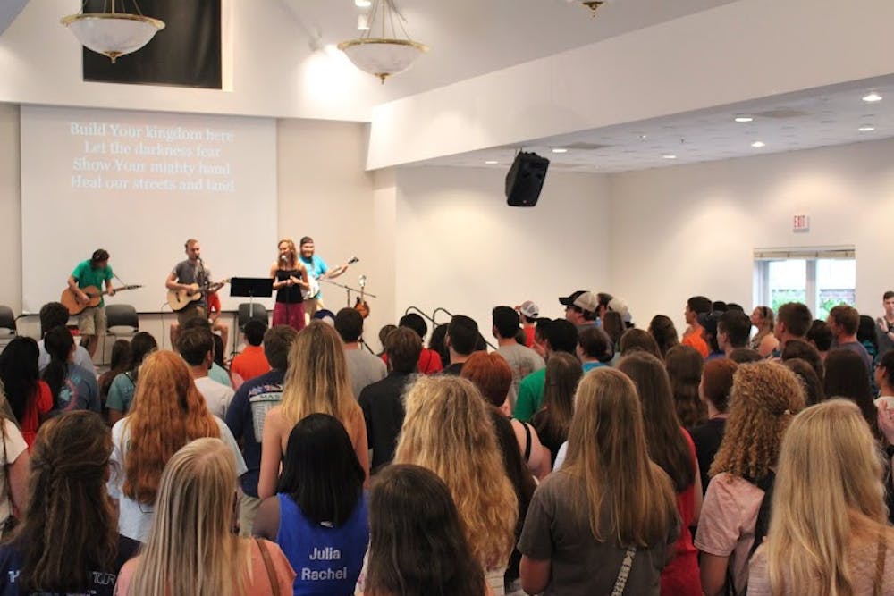 Students gather at the Christian Organization Welcome (COW) Party for a time of worship and fellowship. Photo creds Sarah Pounds
