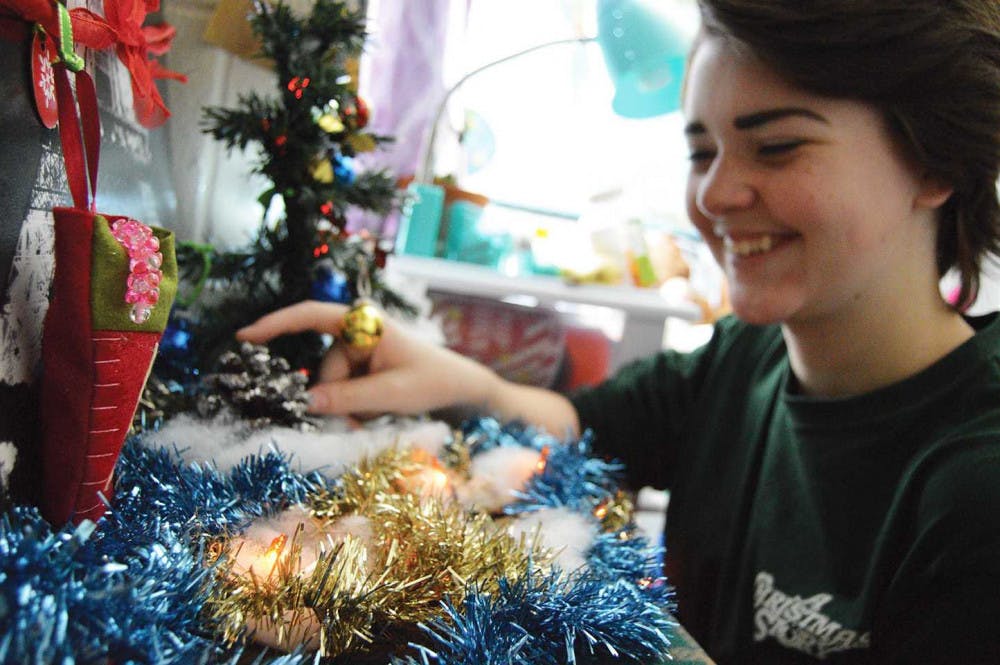 Monica Lesley Stephenson decorates for Christmas.