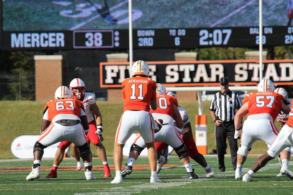 Quaterback Braden Atkinson '29 catches the snap in a game against Virginia Military Institute on Oct. 25.