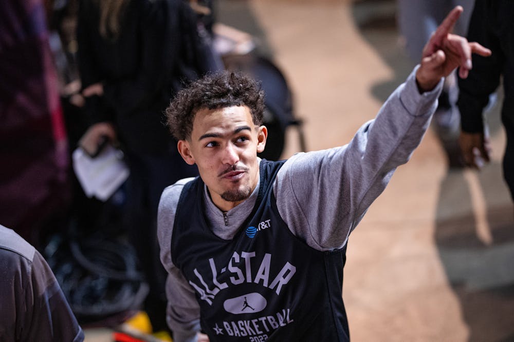 Hawks star point guard Trae Young gesturing to the crowd during All-Star Weekend. Credit: Erik Drost on Flickr