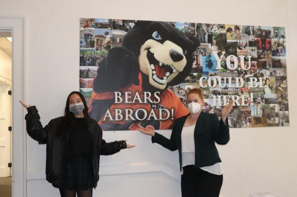 <p>Amy Pham (left) and Rebekah Anaya (right) stand in front of the Bears Abroad poster in Ryals Hall.<br/></p>