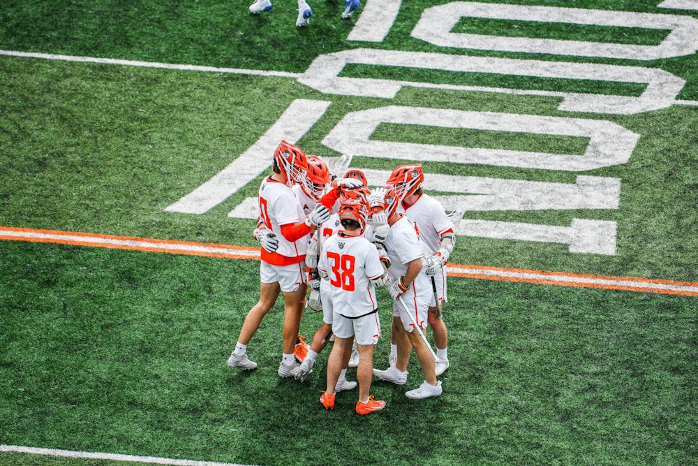 The men's lacrosse team huddles up in a game against Hampton University on January 31.