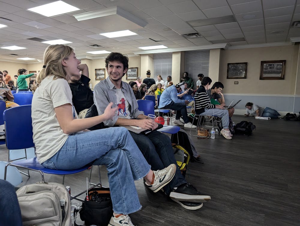 Sophia Hall '26 and Liam Donovan '27 talk during the election night watch party.