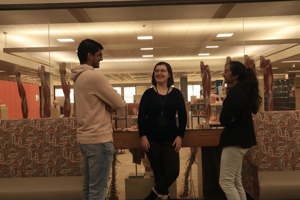 Mercer pre-medical SCP Student Grace Taylor (middle) speaks with Mercer SCP medical students Aditi Dave (right) and Anish Sutaria (left) in the Mercer Medical School.
