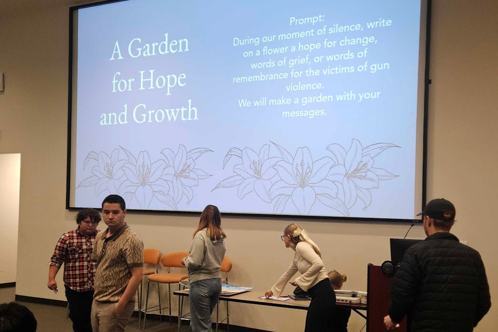 <p>Mercer Young Democrats invited participants of the gun violence memorial to process grief in Willet Auditorium on Nov. 18, 2025.</p>