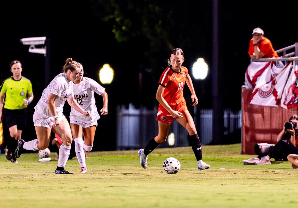 <p>Maria Karipidis &#x27;27 dribbles against former Mercer player Larkin Thomason﻿ in Friday&#x27;s 3-0 loss at the University of Alabama.</p>