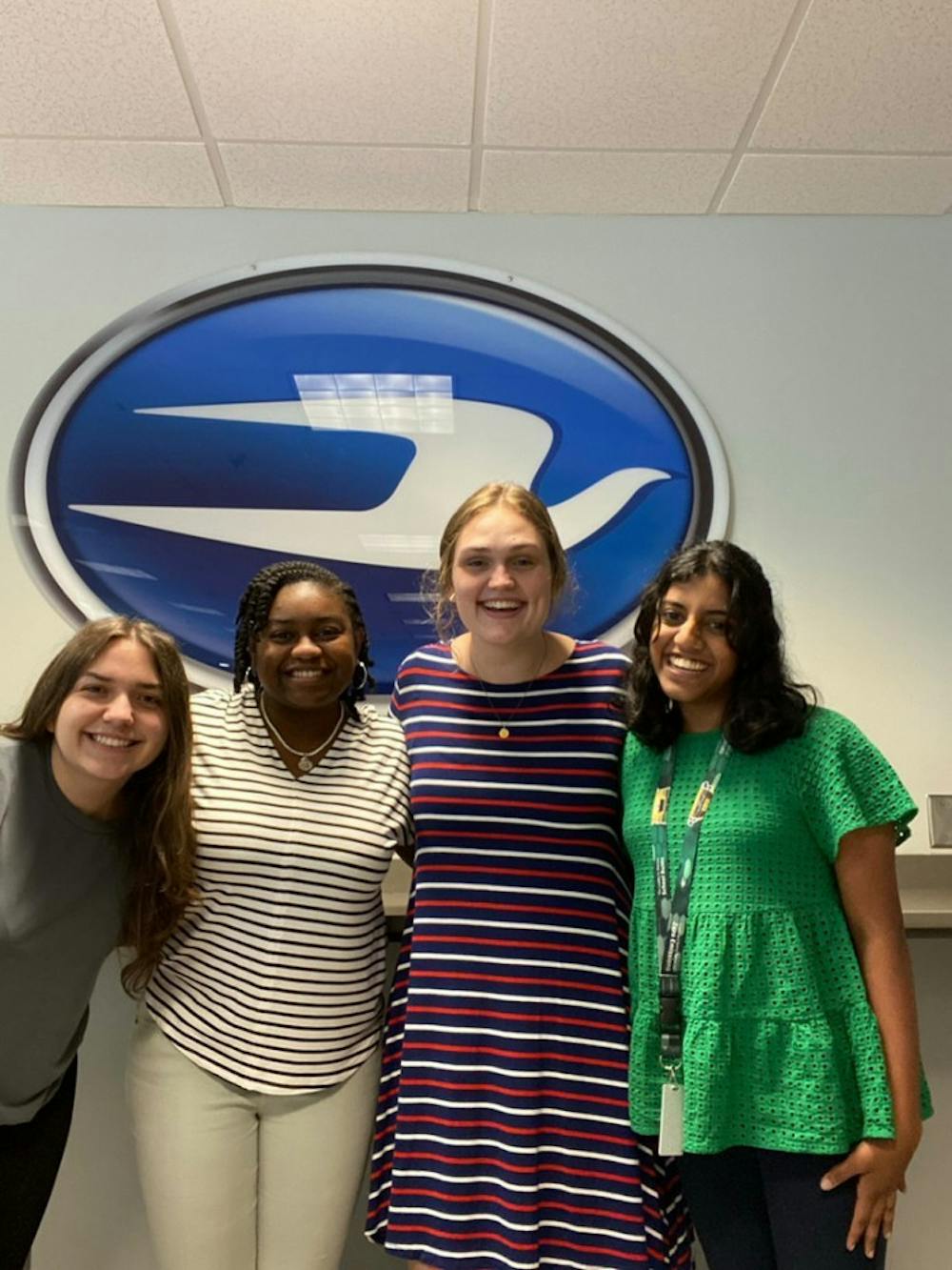 (Left to right) Kimberly Lopez, Asia Cladd, Christianne Grist and Hannah Jeevanayagam  posing at their internship with Blue Bird. The four of them are just a few of the Mercer students who worked at the bus manufacturer this summer. Photo provided by Hannah Jeevanayagam.