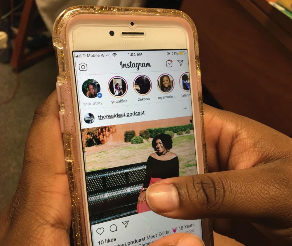 A student scrolls through Instagram. 