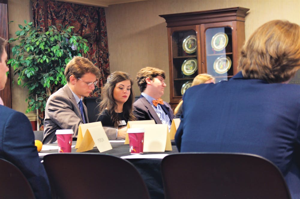 SGA President Elizabeth McKay and Vice President Aaron Scherf conduct a weekly Senate meeting.