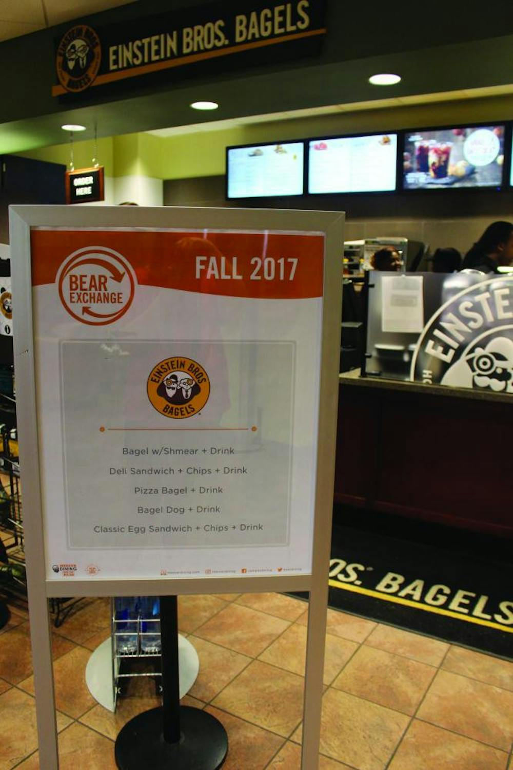 The new options for meal exchanges are listed on a sign at Einstein's Bagels. 